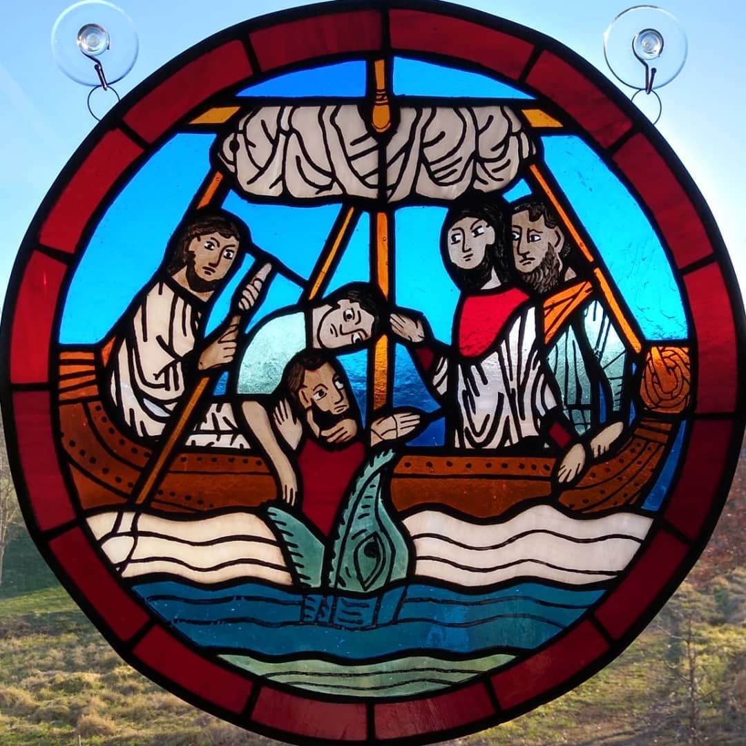 Stained glass window of Jonah and the Whale